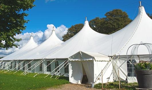 a line of portable restrooms in a shaded area, offering a comfortable experience for users in Magnolia